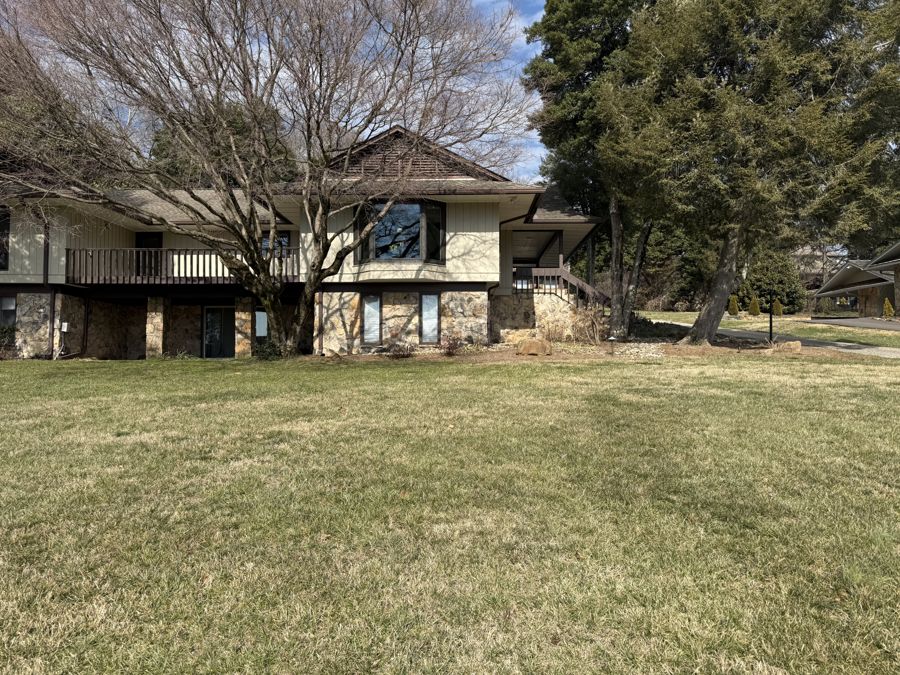 Wide lawn shot showing overall condition